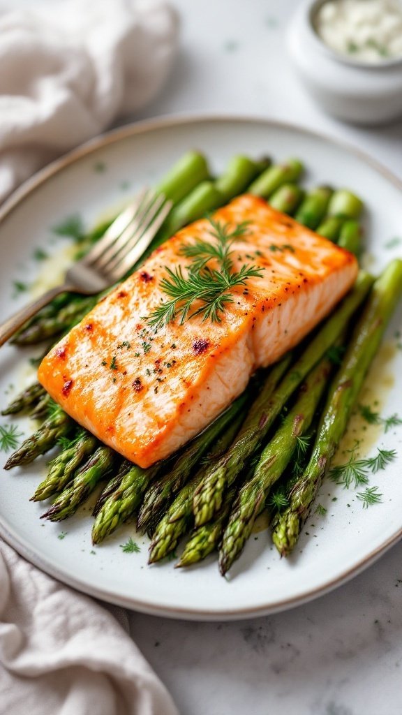 Baked salmon fillet served on a plate with asparagus and dill.